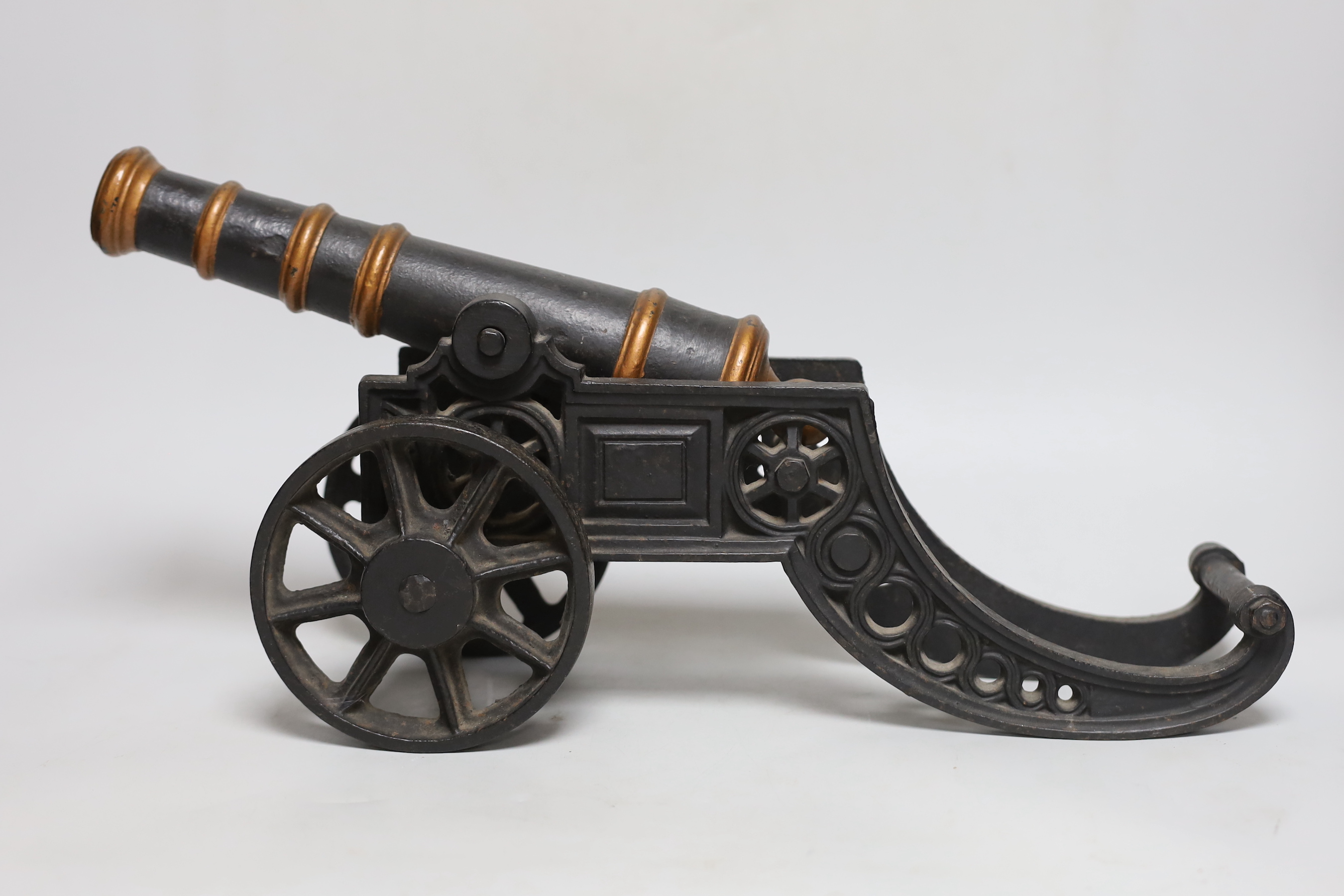 A pair of cast iron models of cannons, 48cm long